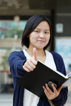 Asian woman thumbs up