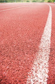 a close up of white line on red racetrack, for sports, concept background.