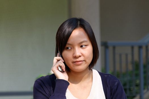 Asian woman talking phone
