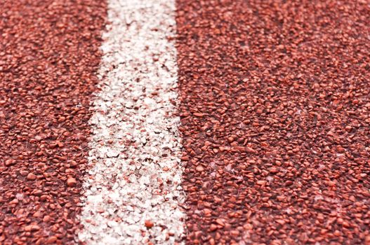 a close up of white line on red racetrack, for sports, concept background.