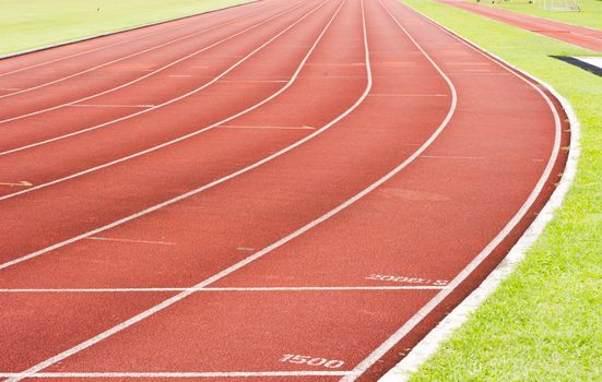 a close up of white line on red racetrack, for sports, concept background.