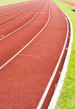 a close up of white line on red racetrack, for sports, concept background.