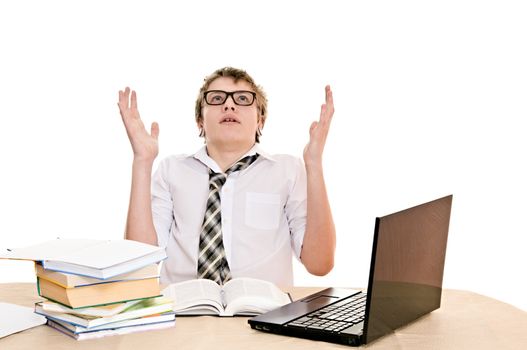 teenager student sits behind a desk isolated on white background