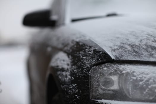 fragment of the car, front view, snow ice freezing speed