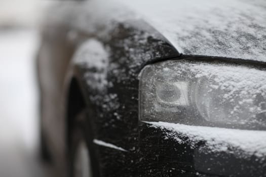 fragment of the car, front view, snow ice freezing speed