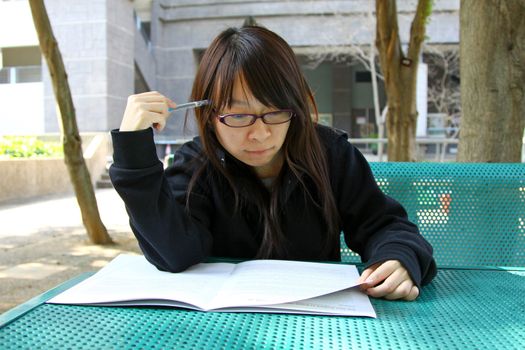 Asian girl studying in university