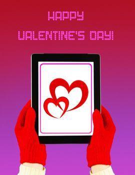 Hands wearing red gloves holding a tablet PC with Valentine's Day greeting