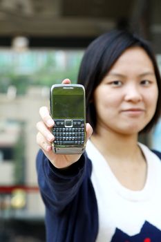 Asian woman shows her mobile phone