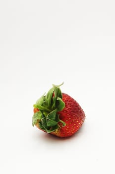 a single and isolated strawberry.