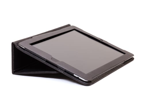 internet tablet in black leather cover on white background