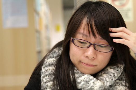 Asian woman thinking and studying