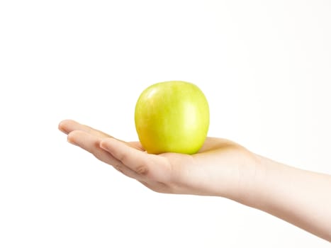 Apple in the palm og childs hand - on white background