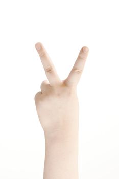 Victory sign shown by childs hand - on white background
