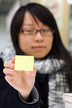 Asian student with yellow memo paper