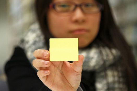 Asian student with yellow memo paper