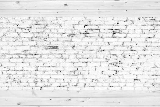 Old brick wall with white bricks and wood planks