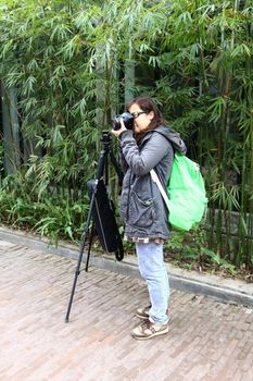 Female photographer with tripod