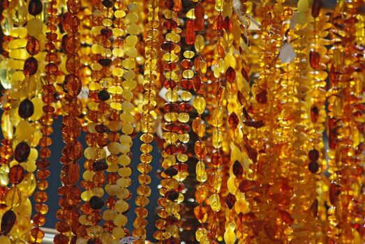 Various amber necklaces are sold in the street market