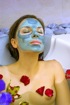 beautiful woman takes treatment in spa salon
