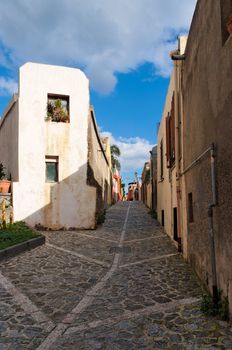 Small street in Italian town converging in perspective