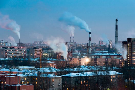 Pipes in industrial district make smoke, Saint-Petersburg, Russia