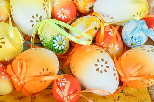 close up of painted easter eggs with ribbon