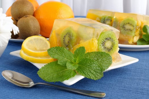 With a variety of fruit jelly with mint close up