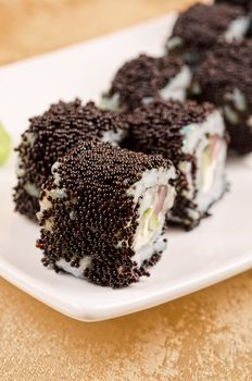 sushi roll with tuna, avacado, sauce and flying fish roe