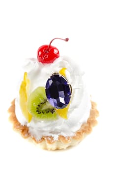 cupcake and bijouterie flower on a white background