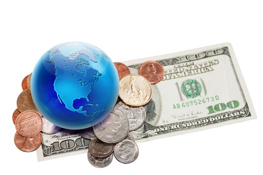 World currency. Globe view to North America on dollar coins and banknote. Focus on globe.