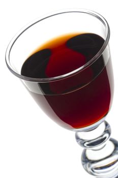 Sherry, port or whisky in an elegant glass and isolated against white