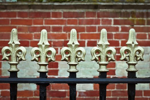 Traditional metal railings in front of a wall