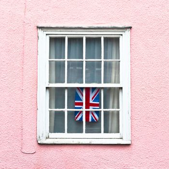 Brish flag hanging in a window in a Suffolk cottage