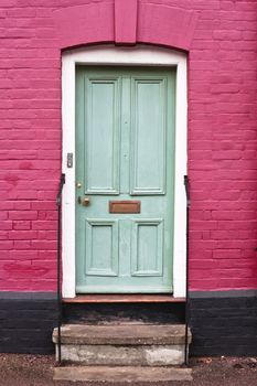 Green wooden front door of an english house