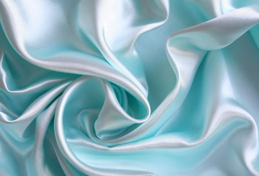 Smooth elegant blue silk as background 