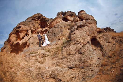 bride and groom in the mountains