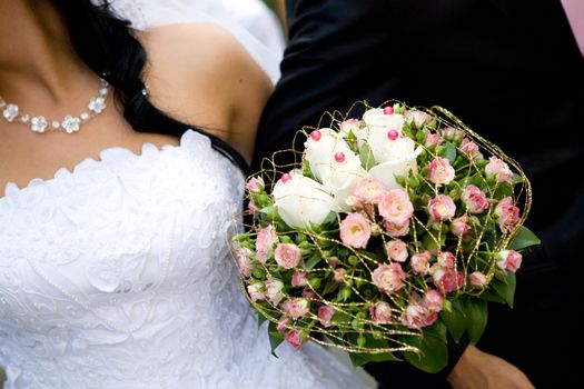 unusual bouquet in hands of the groom