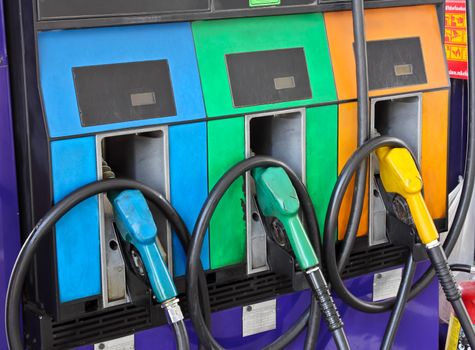 Old gas pump filling nozzles in a refueling station