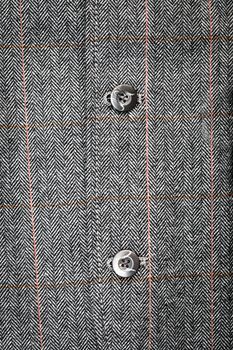 Close up of the buttons of a formal men's suit jacket