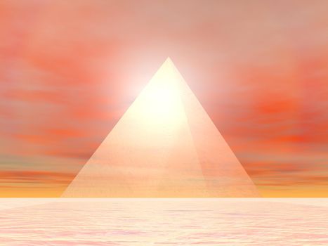 Transparent pyramid made of glass in front of sunset