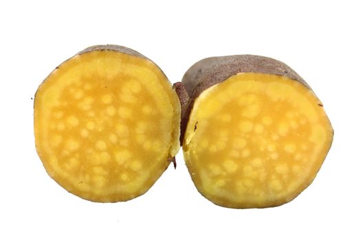 cutting sweet potatoes on white background