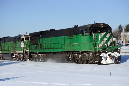 Black and green freight locomotive and wagon