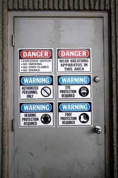 Indastrial doorway  with warning signs