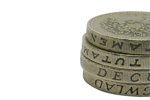 A pile of pound coins with copy space