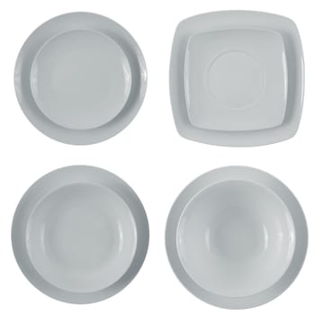 Set of empty white plates on white background.