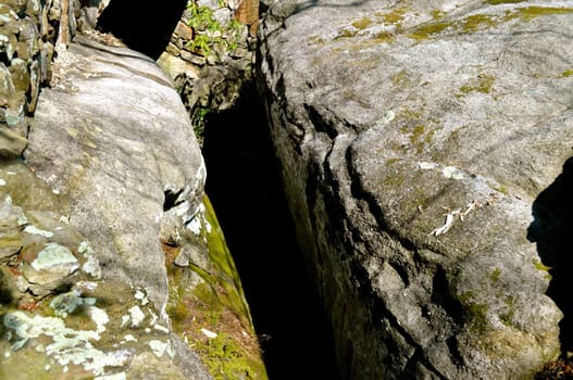 Crevice between two boulders
