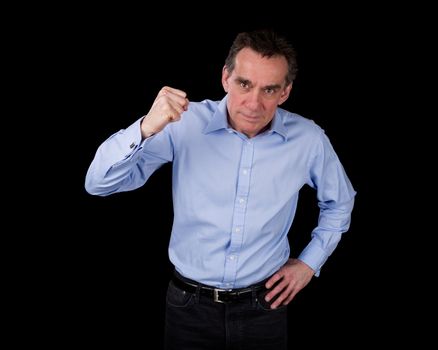 Angry Middle Age Business Man Shaking Fist Black Background