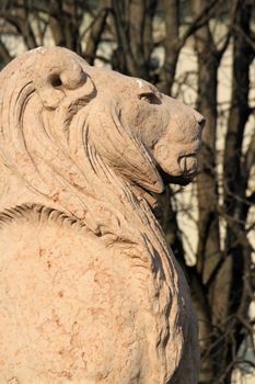 Lion made of stone guarding Brunswick monument at the entrance of Alps garden, Geneva, Switzerland