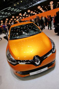 GENEVA - MARCH 8 : orange Renault Clio on display at the 83st International Motor Show Palexpo - Geneva on March 8, 2013 in Geneva, Switzerland.