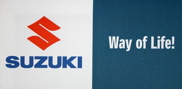 GENEVA - MARCH 8 : Suzuki logo on display at the 83st International Motor Show Palexpo - Geneva on March 8, 2013 in Geneva, Switzerland.